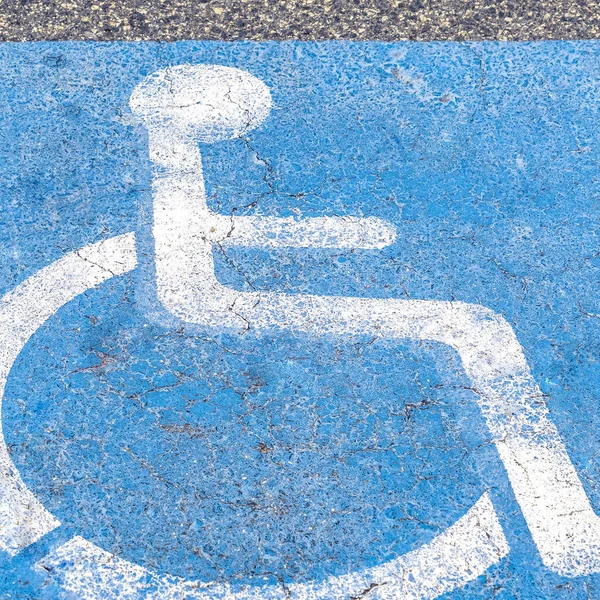 Square frame Disabled or Handicapped road sign on asphalt