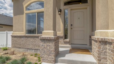 Panorama Home entrance with steps white front door sidelight arched windows and yard