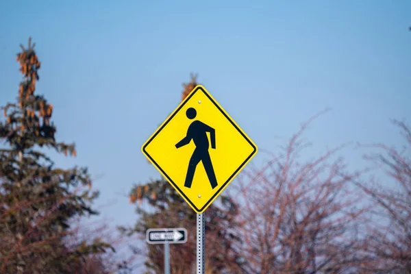 Traffic warning sign for a pedestrian crossing — 스톡 사진