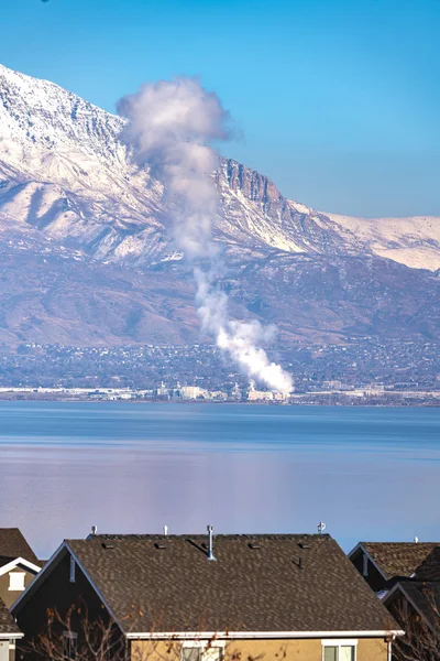 Plume of smoke rising from a fire on Utah Lake