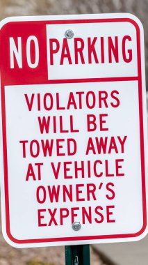 Vertical No Parking sign with Tow Away warning