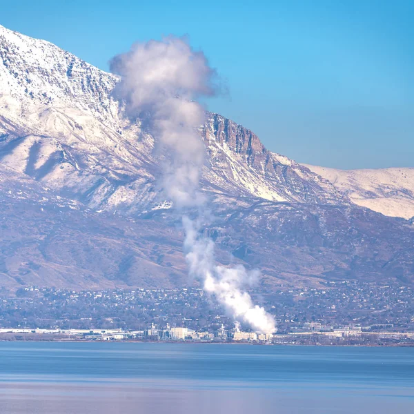 Square frame Plume of smoke rising from a fire on Utah Lake