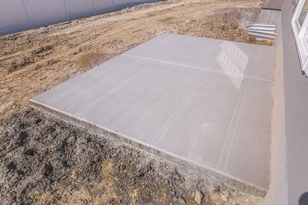 Flat horizontal concrete surface soil at a home under construction — 스톡 사진