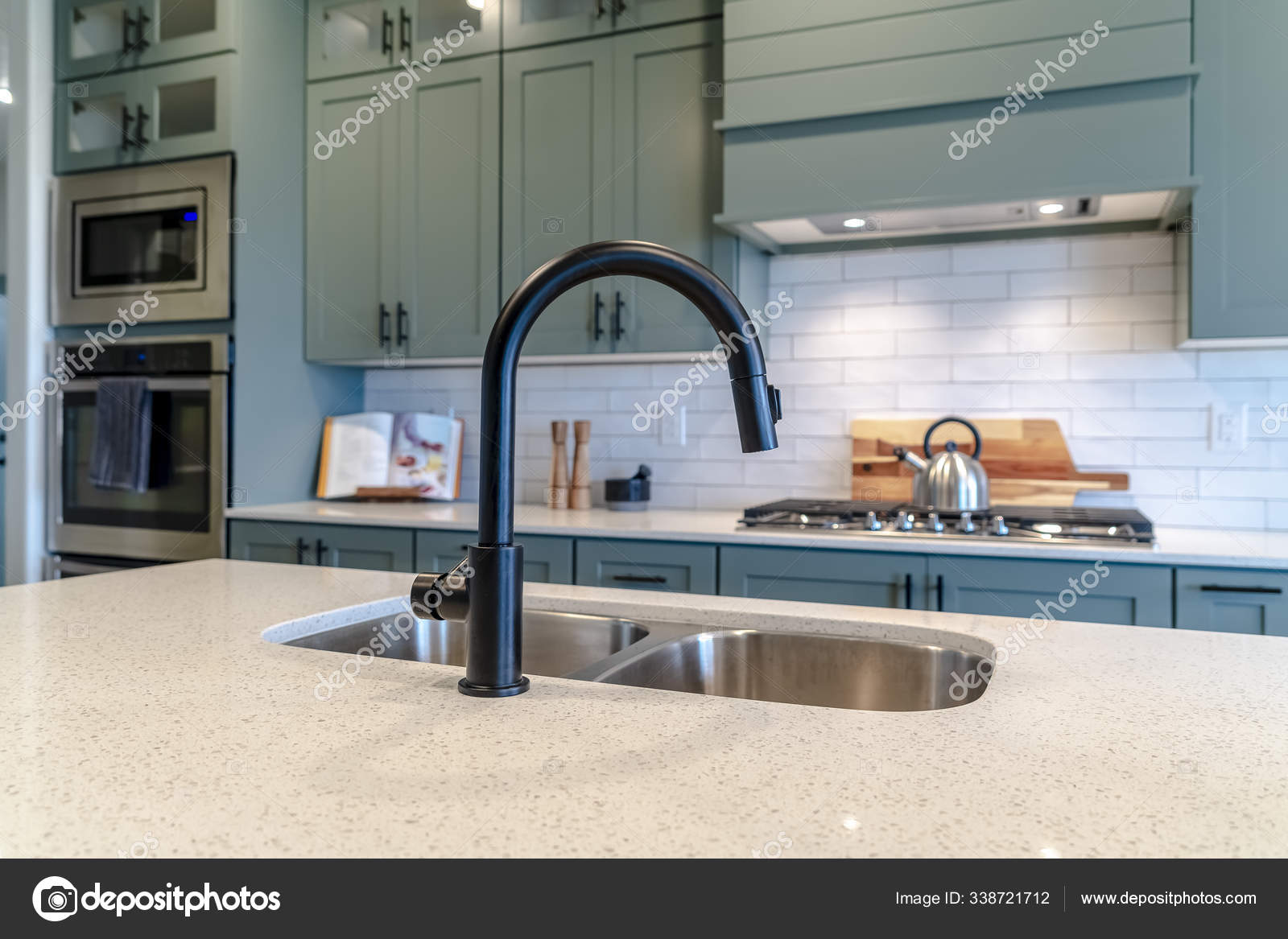 Kitchen Island Sink With Black Faucet Against Cooking Appliances And Cabinets Stock Photo By C Dropthepress Gmail Com