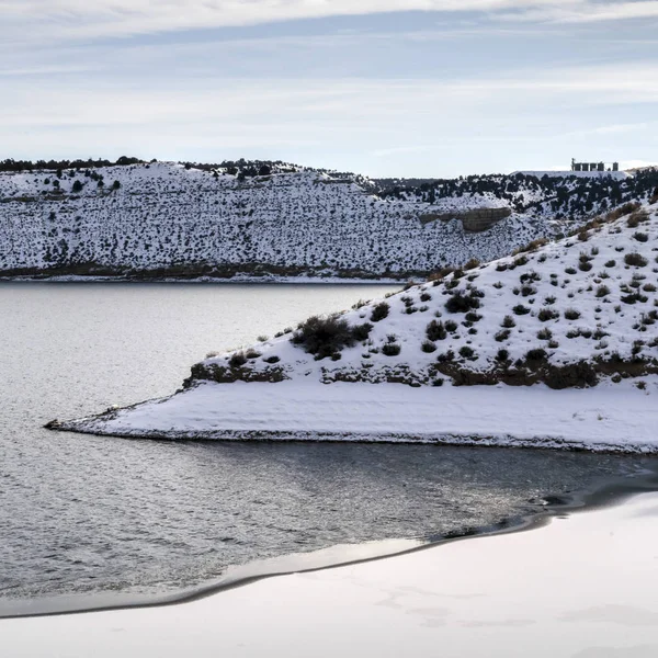 Square Sunny winter day views with cold calm lake and hills blanketed with white snow — Stock Photo, Image