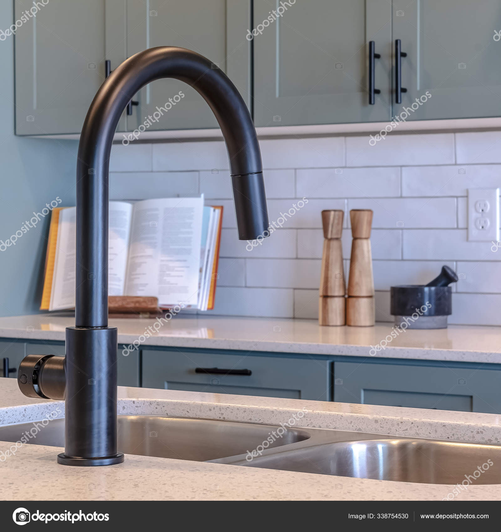 Square Frame Kitchen Island Sink And Black Faucet Against Cooktop Cabinets And Appliances Stock Photo Image By Dropthepress Gmail Com 338754530