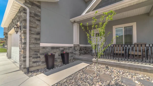 Panorama Home with gray and brick wall and landscaped yard leading to the entrance — Stock Photo, Image