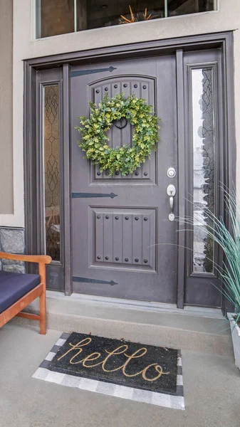 Vertical Beautiful home entrance with gray door sidelights and huge transom window