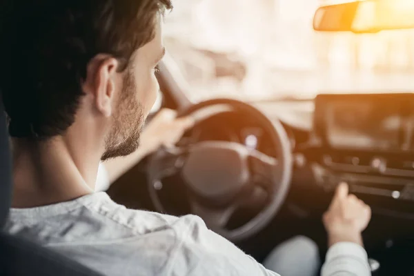 Man in car dealership — Stock Photo, Image