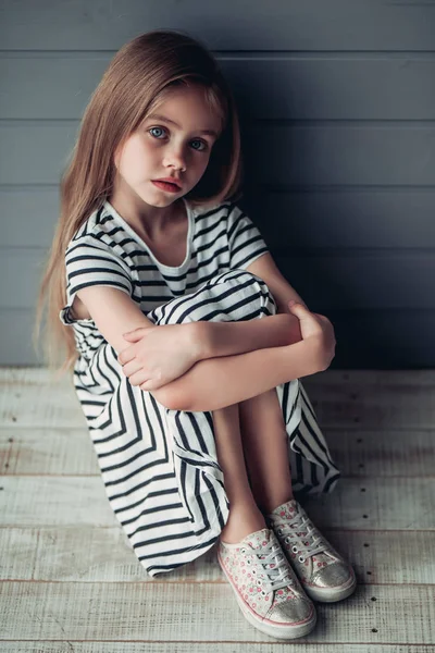 Cute little girl on grey background — Stock Photo, Image