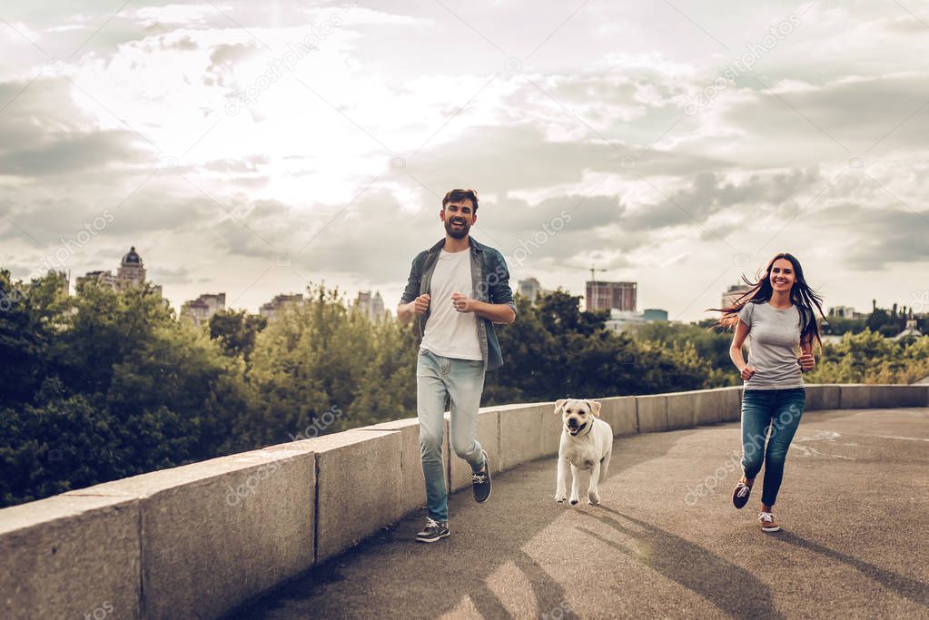 Couple on a walk with dog
