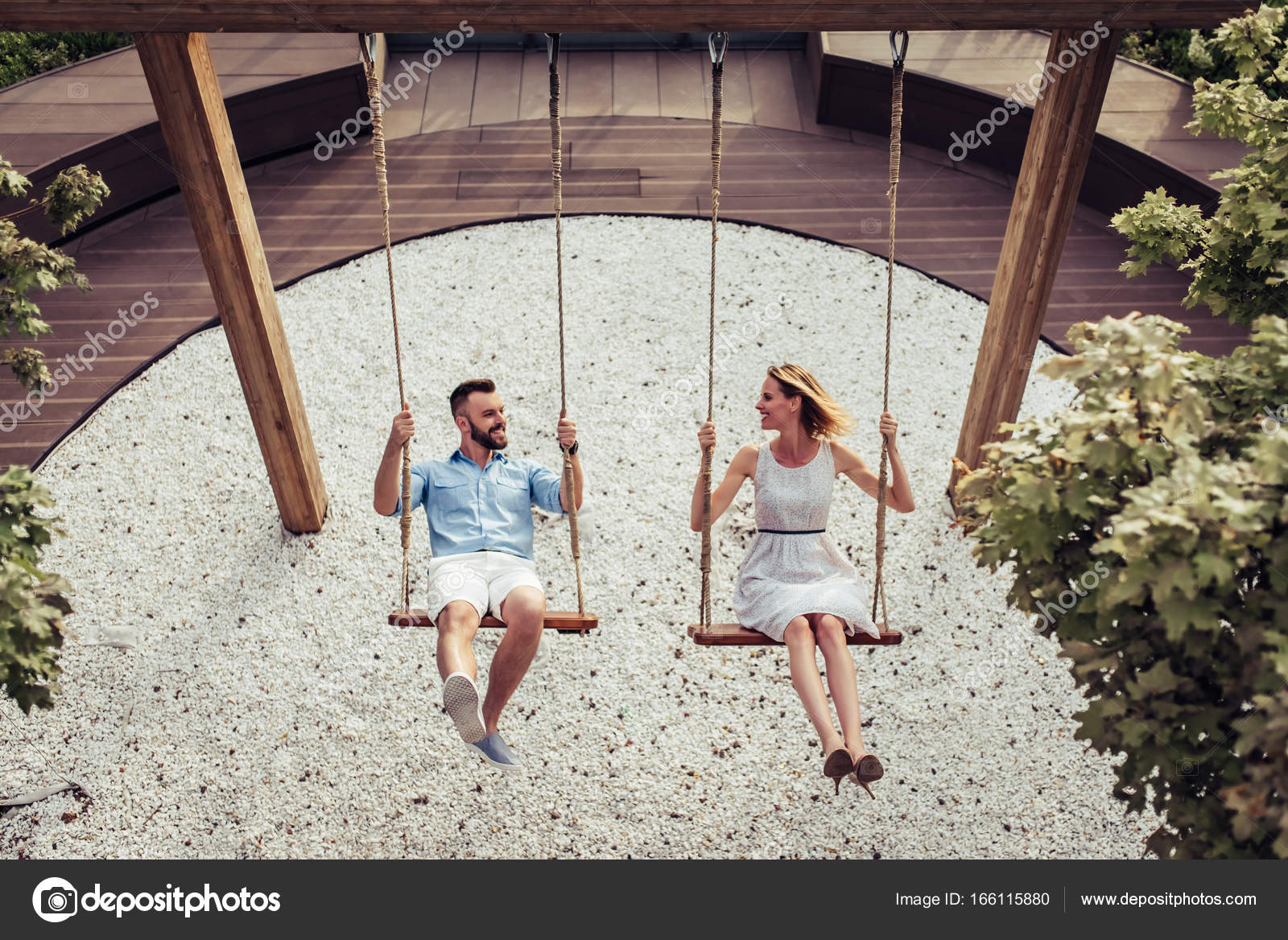 Couple in romantic swing in hi-res stock photography and images