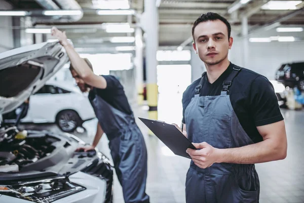 Handsome auto service mechanics