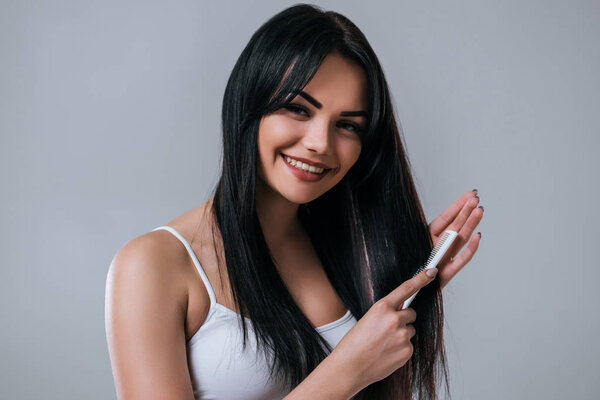 Beautiful woman on grey background