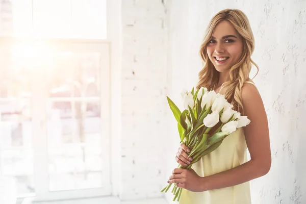 Young woman with tulips — Stock Photo, Image