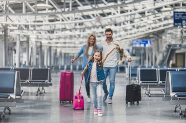 Family in airport clipart