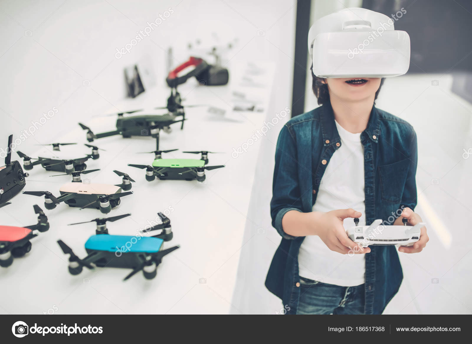 Boy in quadcopter store Stock Photo by 186517368