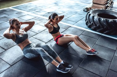 Sporty women in gym clipart