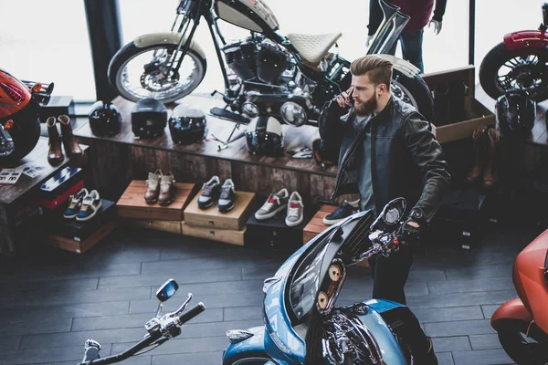 Man in motorcycle shop