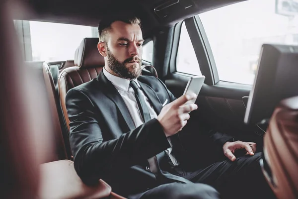 Businessman in car — Stock Photo, Image