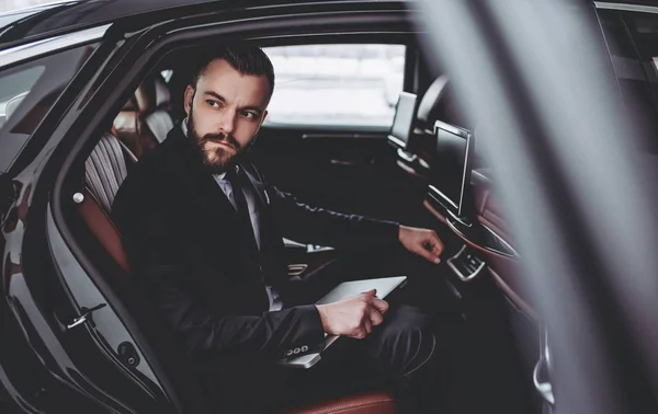 Businessman in car — Stock Photo, Image