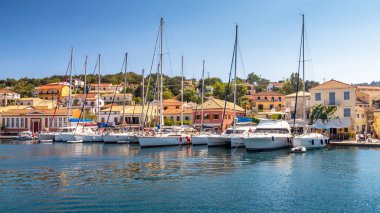 Sailboats in the port of Gaios on Paxos island. clipart