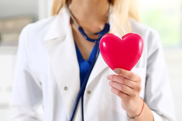 Female medicine doctor hands holding red heart — Stock Photo, Image