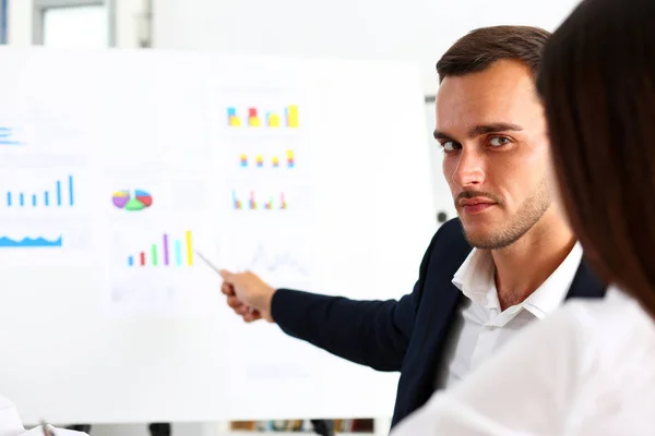 Group of people deliberate on white board problem — Stock Photo, Image
