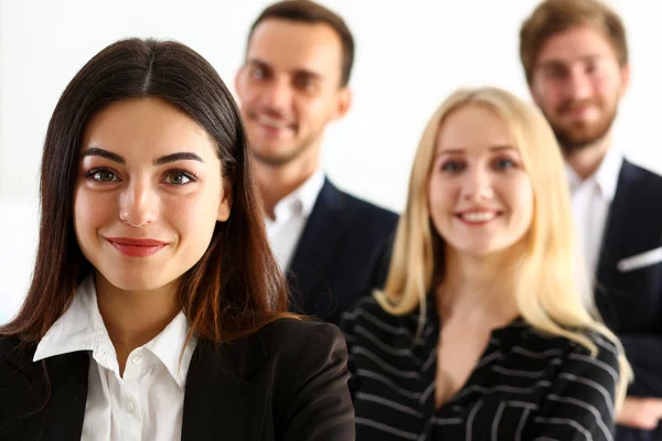 Group of smiling people stand in office looking in camera — Stock Photo, Image