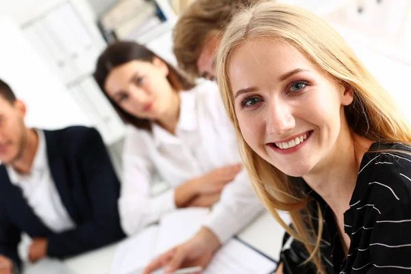 Beautiful smiling cheerful girl at workplace look in camera — Stock Photo, Image