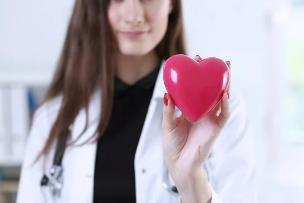 Female medicine doctor hands holding red heart — Stock Photo, Image