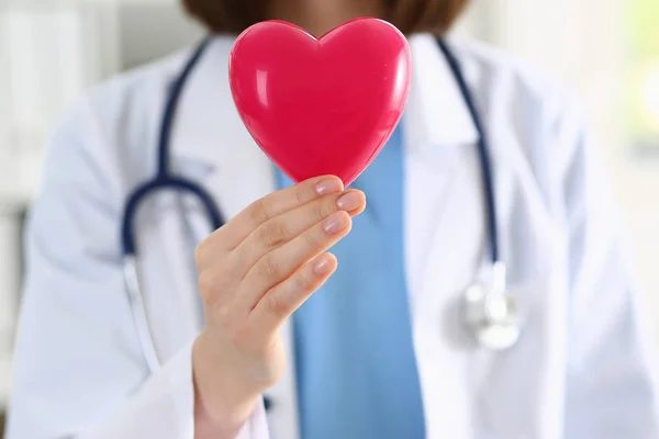 Female medicine doctor hands holding red heart — Stock Photo, Image