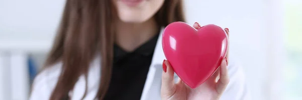 Female medicine doctor hands holding red heart — Stock Photo, Image