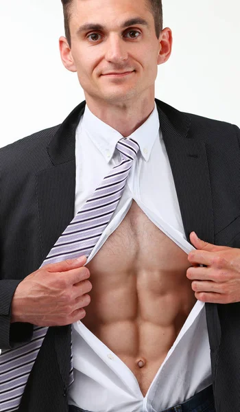 Handsome smiling man in tie rip clothes off torso showing abs. — Stock Photo, Image