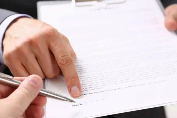 Male arm in suit offer contract form on clipboard pad — Stock Photo, Image