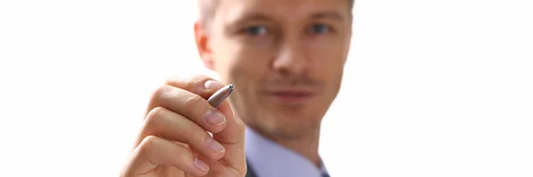 Male arm in suit and tie fill form clipped to pad — Stock Photo, Image