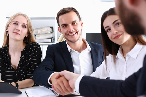 Smiling man in suit shake hands as hello in office — Stock Photo, Image