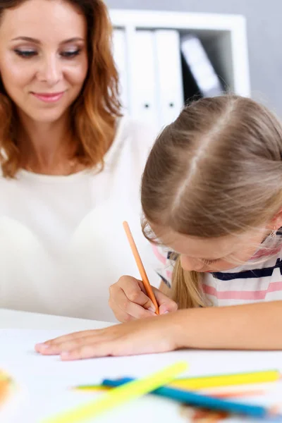 Blond little girl hold in arm pencil drawing — Stock Photo, Image