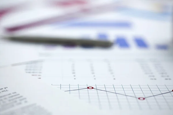 Financial statistics documents on clipboard pad at office table closeup — Stock Photo, Image