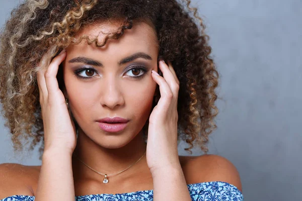 A beautiful black woman portrait. Tests the emotion of bewilderment