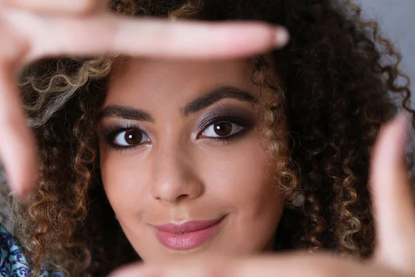 Beautiful black woman portrait. She put her hand around