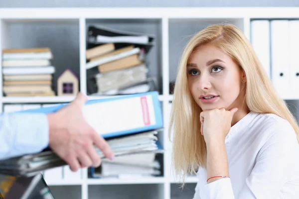 Female employee show pack of documents