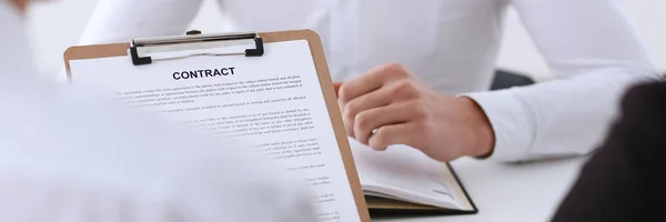 Male arm in shirt offer contract form on clipboard — Stock Photo, Image