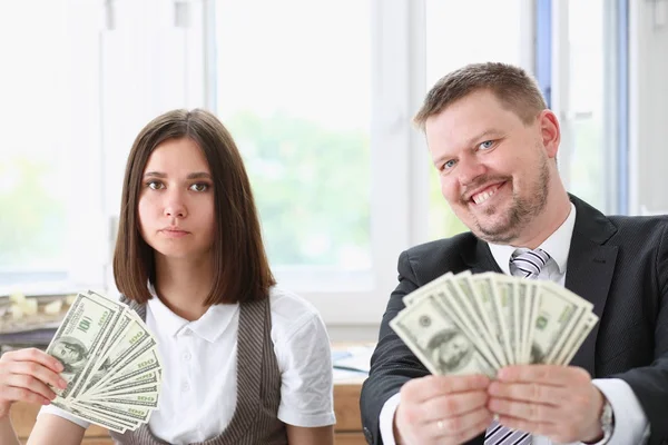 A man and a woman enjoy light money — Stock Photo, Image