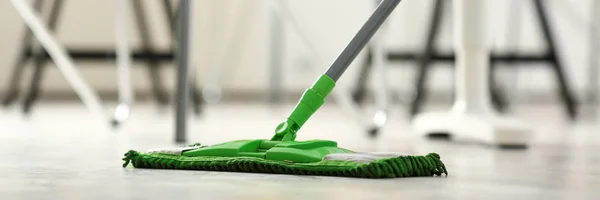 Green plastic mop — Stock Photo, Image