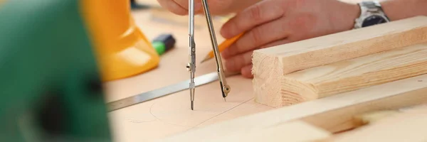 Arms of worker making structure plan Stock Photo