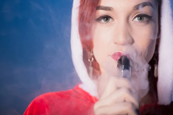 A redhead woman in a Santa suit