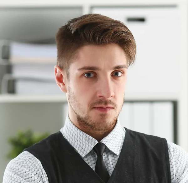 Handsome man in suit and tie stand in office