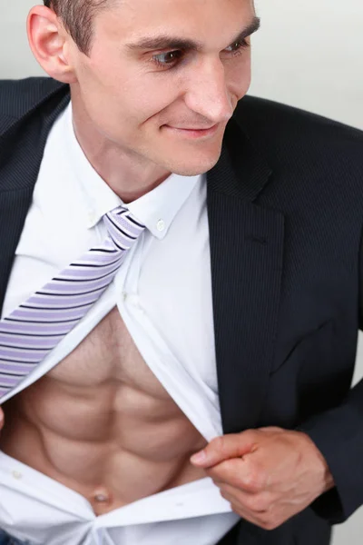 Man in tie rip clothes off torso showing abs — Stock Photo, Image