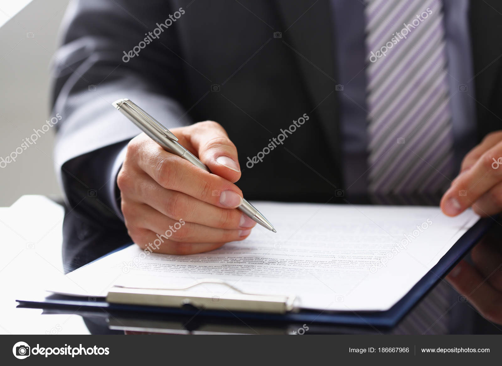 Male Arm In Suit And Tie Fill Form Clipped Stock Photo
